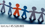 Colorful paper cutout figures holding hands, symbolizing unity, diversity, equality, on blue background, representing community support, collaboration, inclusivity, teamwork, multicultural society. Стоковое AI-изображение, AI-художник Павел Муравьев / Фотобанк Лори
