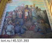 Varna, Bulgaria. August 15, 2024. City center. The Church of St. Nicholas the Wonderworker. A painting on the wall of the church depicting Saints Cyril and Methodius surrounded by people. Редакционное фото, фотограф Мария Фетисова / Фотобанк Лори