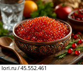 Red caviar in a wooden bowl. A beautiful and original appetizer for a festive table. Enjoy your meal! Стоковое AI-изображение, AI-художник Сергей Елизарьев / Фотобанк Лори