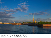 Peter and Paul Fortress and Vasilievsky Island from the Trinity Bridge over the Neva River on a sunny summer morning with clouds, St. Petersburg, Russia. Стоковое фото, фотограф Ula Ulachka / Фотобанк Лори