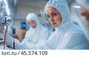 Scientists in protective gear conduct research in a laboratory environment aimed at medical breakthroughs. Стоковое AI-изображение, AI-художник Сергей Толмачёв / Фотобанк Лори