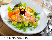 Ceviche from salmon with avocado, cumquat and green dill at plate with flower. Стоковое фото, фотограф Яков Филимонов / Фотобанк Лори