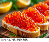 Sandwiches with red caviar. A beautiful and original snack for a festive table. Enjoy your meal! Стоковое AI-изображение, AI-художник Сергей Елизарьев / Фотобанк Лори