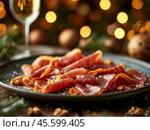 Thin slices of jamon. Jamon (in Spanish jamon - "ham") is a national dish of Spain, a dry-cured pork leg. Only the hind legs of the pig are used for jamon, which are dried whole. Enjoy your meal! Стоковое AI-изображение, AI-художник Сергей Елизарьев / Фотобанк Лори