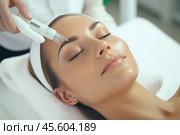 A woman relaxes while undergoing a hydro microdermabrasion treatment, enhancing her skin\'s hydration and exfoliation at a beauty spa clinic. Стоковое AI-изображение, AI-художник Sergey Grishin / Фотобанк Лори