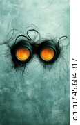 Steampunk goggles with intricate wire details on a textured teal background, AI. Стоковое AI-изображение, AI-художник Сергей Старуш / Фотобанк Лори
