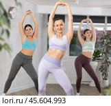 Happy woman training vigorous zumba in fitness studio. Стоковое фото, фотограф Яков Филимонов / Фотобанк Лори