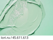Color correcting concealer stroke. Mint green corrector cream smudge swatch sample. Makeup base foundation creamy texture. Beauty industry, cosmetics. Smooth cosmetic smear of pastel green cream. Стоковое AI-изображение, AI-художник Марина Демидюк / Фотобанк Лори