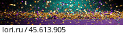 Vibrant celebration Mardi Gras with gold confetti on purple and green backdrop. Стоковое AI-изображение, AI-художник Lamina Akulova / Фотобанк Лори
