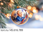 Елочный шар с портретом президента Российской Федерации Владимира Путина. Редакционное AI-изображение, AI-художник Щеголева Ольга / Фотобанк Лори