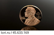 Moscow December 03 2024 Nobel Prize. Alfred Nobel Prize concept, Gold award with Nobel image. Peace Prize. Редакционное фото, фотограф Скрипачев Антон / Фотобанк Лори