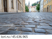 Ansient town street with old cobblestone pavement. Стоковое AI-изображение, AI-художник Евгений Харитонов / Фотобанк Лори