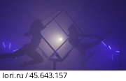 Two Acrobats Performing Tricks Together Inside a Cube. Стоковое видео, видеограф Илья Шаматура / Фотобанк Лори