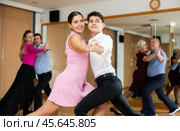 Young couple dancing slow ballroom dance in choreography studio. Стоковое фото, фотограф Яков Филимонов / Фотобанк Лори