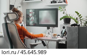 Modern technologies expand artistic creativity: AI and neural networks revolutionize workflows, enabling designers generate stunning images. Showcasing innovation, creativity, and cozy holiday vibes. Стоковое видео, видеограф Енваев Андрей / Фотобанк Лори