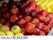 Red apple fruits are stacked in large and capacious boxes. Стоковое фото, фотограф Яков Филимонов / Фотобанк Лори