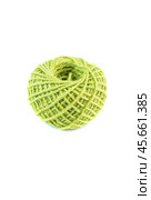 A roll of green jute twine placed on a white background, ideal for crafting, packaging, and DIY projects. Perfect for online stores or product catalogs showcasing eco-friendly materials. Стоковое фото, фотограф Татьяна Терехина / Фотобанк Лори