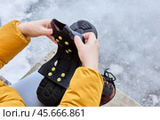 Ice cleats for shoes, traction on sidewalks of this over footwear rubber pad is provided by 10 spikes. Стоковое фото, фотограф Владимир Григорьев / Фотобанк Лори