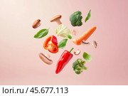 Various colorful vegetables falling at pale pink background. Flying veggie on a plain pastel color backdrop. Healthy food. Detox and dieting concept. Fresh carrot, pepper, broccoli, tomato levitating. Стоковое AI-изображение, AI-художник Марина Демидюк / Фотобанк Лори