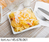 Homemade pickled cabbage on white plate closeup, natural probiotic. Стоковое фото, фотограф Яков Филимонов / Фотобанк Лори