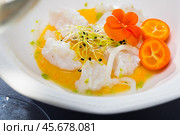 Seafood ceviche from horse-mackerel with spicy avocado sauce, greens and cumquat. Стоковое фото, фотограф Яков Филимонов / Фотобанк Лори