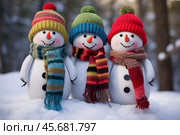 Three cheerful snowmen colorful wearing. Стоковое AI-изображение, AI-художник Михаил Коханчиков / Фотобанк Лори