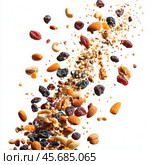 Falling raisins and dried fruits with nuts levitate on a white background in isolation. Стоковое AI-изображение, AI-художник Ярославский Максим / Фотобанк Лори