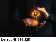 Светящийся ключ парит над рукой. Стоковое AI-изображение, AI-художник Александр Жуков / Фотобанк Лори