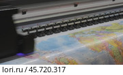 Modern Digital Large format UV printer. Printing production technologies. UV pinning is the process of applying a dose of low intensity ultraviolet light to a UV curable ink. Стоковое видео, видеограф Андрей Армягов / Фотобанк Лори