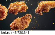 Grilled chicken legs, drumsticks falling in the air, isolated on black background, food concept. Crispy fried chicken nuggets levitation. Roast chicken strips, pieces flying in the air. Dynamic scene. Стоковое AI-видео, аниматор Марина Демидюк / Фотобанк Лори