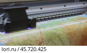 Modern Digital Large format UV printer. Printing production technologies. UV pinning is the process of applying a dose of low intensity ultraviolet light to a UV curable ink. Стоковое видео, видеограф Андрей Армягов / Фотобанк Лори