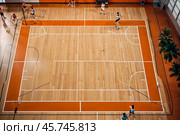 Professional volleyball courts with white lines, nobody. Crop photo of orange volleyball court in sport gym, sporty backdrop. Team game success, healthy sporty lifestyle concept. Copy ad text space. Стоковое AI-изображение, AI-художник Aleksandr Golubev / Фотобанк Лори