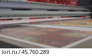 Modern Digital Large format UV printer. Printing production technologies. UV pinning is the process of applying a dose of low intensity ultraviolet light to a UV curable ink. Стоковое видео, видеограф Андрей Армягов / Фотобанк Лори