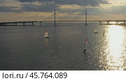Aerial view of cable-stayed bridge during sunset. Стоковое видео, видеограф Михаил Коханчиков / Фотобанк Лори