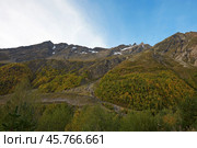Autumn mountain landscape. A rocky mountain with snow remnants on the top and avalanche protection on the slope. Elbrus region. Стоковое фото, фотограф Роман Дзюбало / Фотобанк Лори