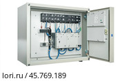 Open electrical cabinet showing fuses, wires, and components. Стоковое AI-изображение, AI-художник Юрий Поздников / Фотобанк Лори