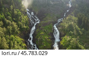 Latefossen is one of the most visited waterfalls in Norway and is located near Skare and Odda in the region Hordaland, Norway. Consists of two separate streams flowing down from the lake Lotevatnet. (2019 год). Стоковое видео, видеограф Андрей Армягов / Фотобанк Лори