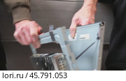Male hands roughly open a computer monitor, close-up. Monitor repair. Стоковое видео, видеограф Кашапова Эльвира / Фотобанк Лори