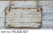Wooden Signboard with Rope. Wood sign board template. Hanging notice board with empty white space. Blank rustic textured vintage board. Timber mock-up, customizable surface. Retro Style Ancient Sign. Стоковое AI-видео, аниматор Марина Демидюк / Фотобанк Лори