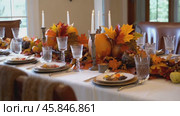 Table with a white tablecloth and a fall themed table setting. Стоковое AI-видео, аниматор Sergey Grishin / Фотобанк Лори