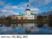 View of the Vyazma Museum of Local History located in the Bogoroditskaya Church on the banks of the Vyazma River on a sunny autumn day with clouds, Vyazma, Smolensk region, Russia. Стоковое фото, фотограф Ula Ulachka / Фотобанк Лори