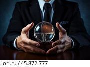 Businessman holding crystal ball predicting future business trends. Стоковое AI-изображение, AI-художник Иван Рябоконь / Фотобанк Лори