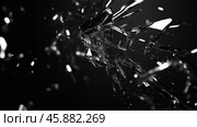 Shattered glass exploding in sharp fragments on dark background. Стоковое AI-изображение, AI-художник Михаил Коханчиков / Фотобанк Лори