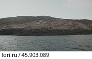 Coastline of steep cliffs overlooking cold Arctic Ocean. Teriberka, Russia, Kola Peninsula. Редакционное видео, видеограф Strunov David / Фотобанк Лори