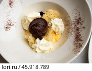 Modern deconstructed tiramisu with chocolate garnish. Стоковое фото, фотограф Яков Филимонов / Фотобанк Лори