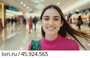 Cheerful woman shopper on a shopping mall background. Young girl walking with colorful shopping bags among a city shopping center. Sale day. Pretty happy female buyer having fun. Black Friday, retail. Стоковое AI-видео, аниматор Марина Демидюк / Фотобанк Лори