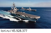 Aircraft carrier navigating with escorting fleet on the ocean. Стоковое видео, видеограф Данил Руденко / Фотобанк Лори