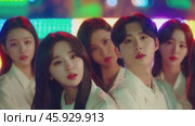 Kpop group posing in front of colorful led wall. Стоковое видео, видеограф Данил Руденко / Фотобанк Лори