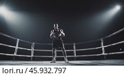 strong muscular boxer in the ring under spotlights before the fight. Стоковое AI-видео, аниматор Александр Довянский / Фотобанк Лори