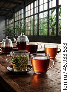Collection of variety ceylon teas on wooden table in meeting room at manufacturing plant on tea factory, still life. Demonstration perfect tea set, close-up. Tea production concept. Copy ad text space. Стоковое AI-изображение, AI-художник Aleksandr Golubev / Фотобанк Лори